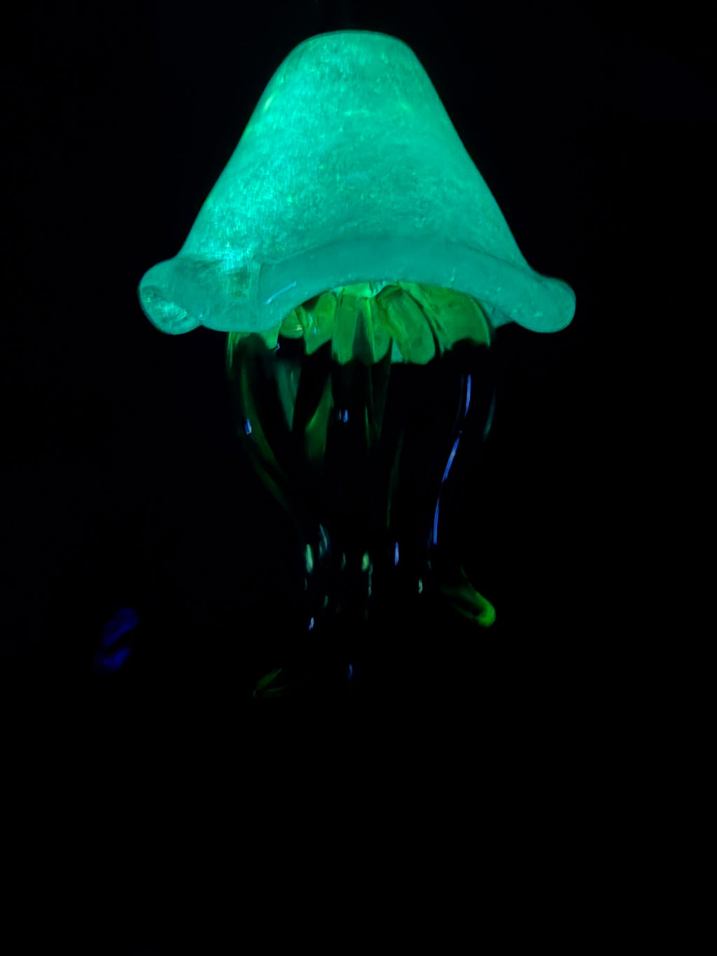 BoroGlow glass jellyfish glowing aqua green in the dark