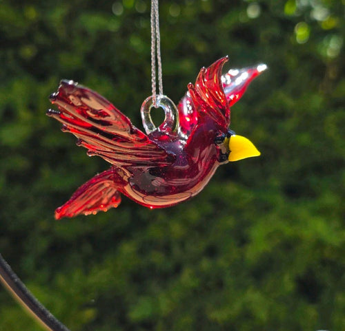 Alternate view of the red glass cardinal ornament showing spread wings and clear hanging loop