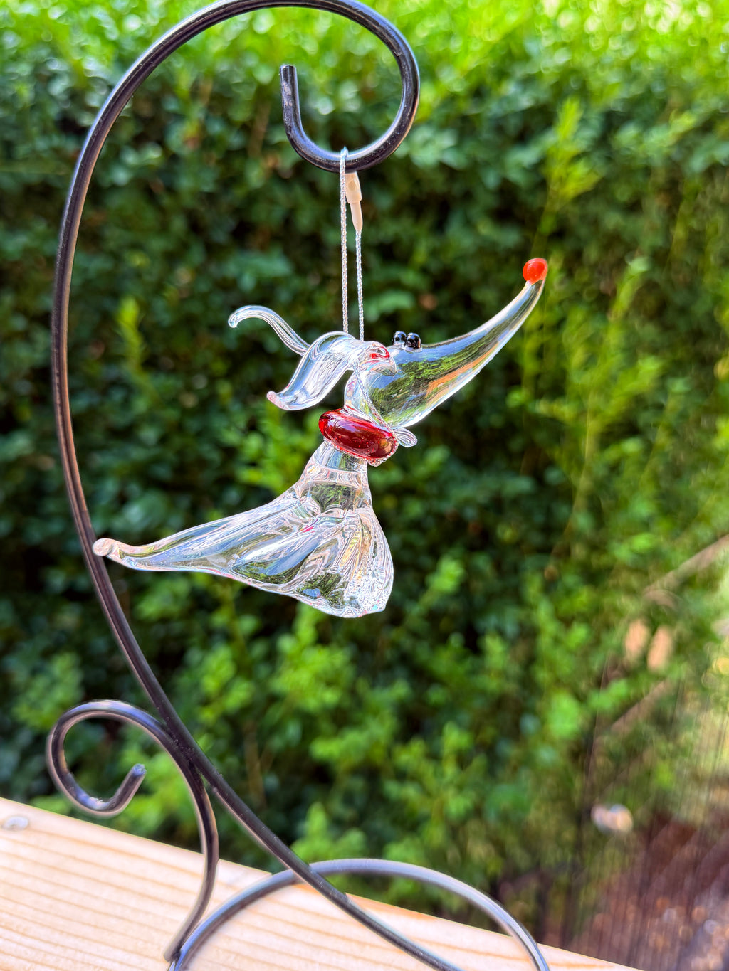 Clear glass Ghost Dog ornament hanging in profile