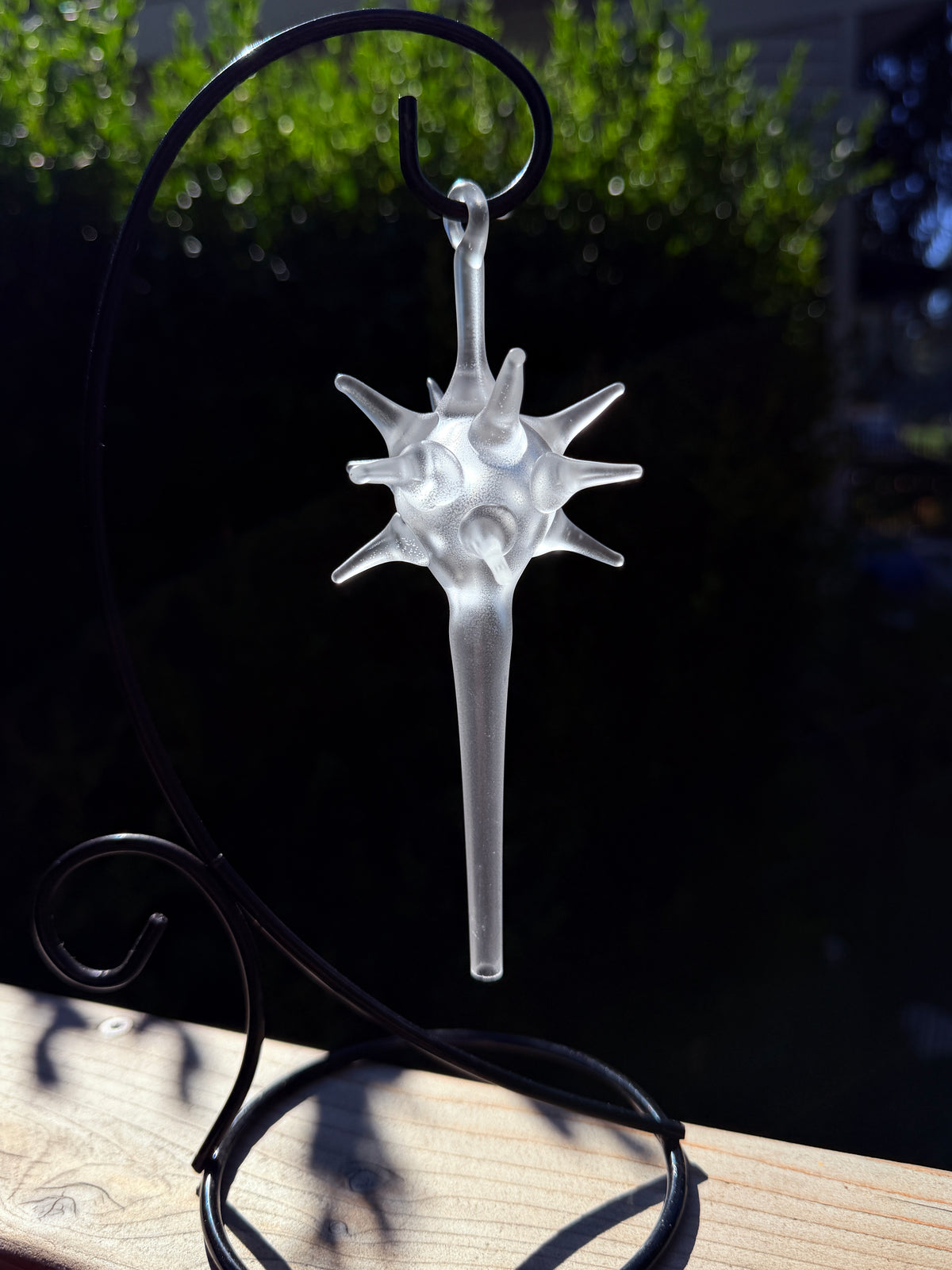 Starburst glass ornament with frosted finish