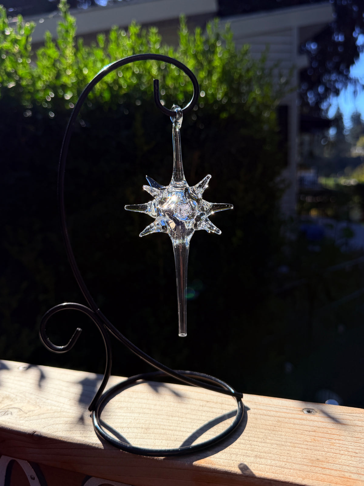 Starburst glass ornament in clear glass