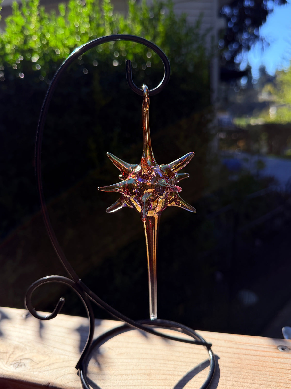 Silver Fume Starburst glass ornament with amber-gold finish