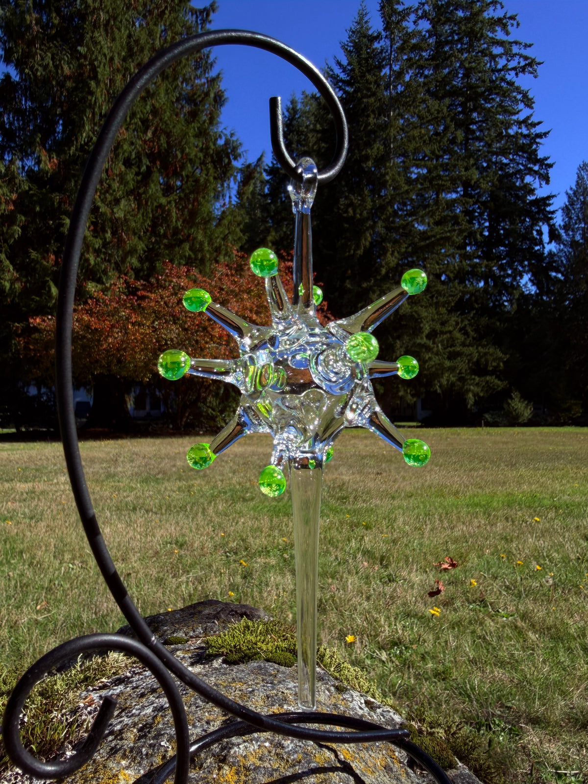 Uranium Atomic Starburst glass ornament outdoors